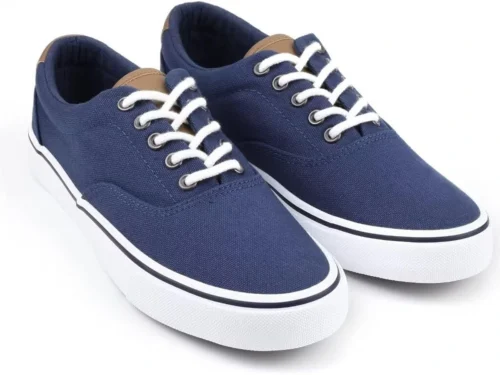 Blue low-top canvas sneakers with white laces and white rubber soles