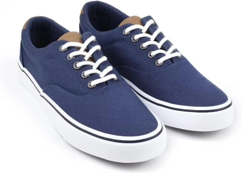 Blue low-top canvas sneakers with white laces and white rubber soles