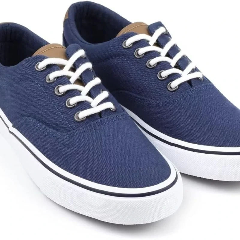 Blue low-top canvas sneakers with white laces and white rubber soles