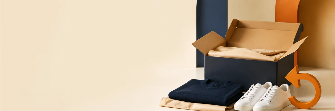 Open parcel with clothing and shoes for an eligible return