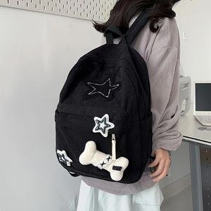 A corduroy casual backpack with star embroidery